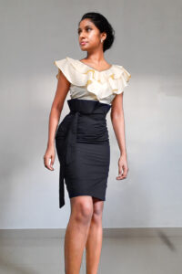 Beyonce - Ruffle Crop Top is with two layers of ruffles around neck and with a zip on the side