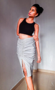 Zeeba - Drawstring Skirt is made from light gray Cotton with stretch and has asymmetrical low waistline and ruched drawstring effect on side Front