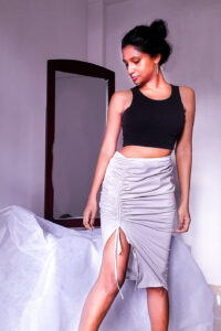 Zeeba - Drawstring Skirt is made from light gray Cotton with stretch and has asymmetrical low waistline and ruched drawstring effect on side Front
