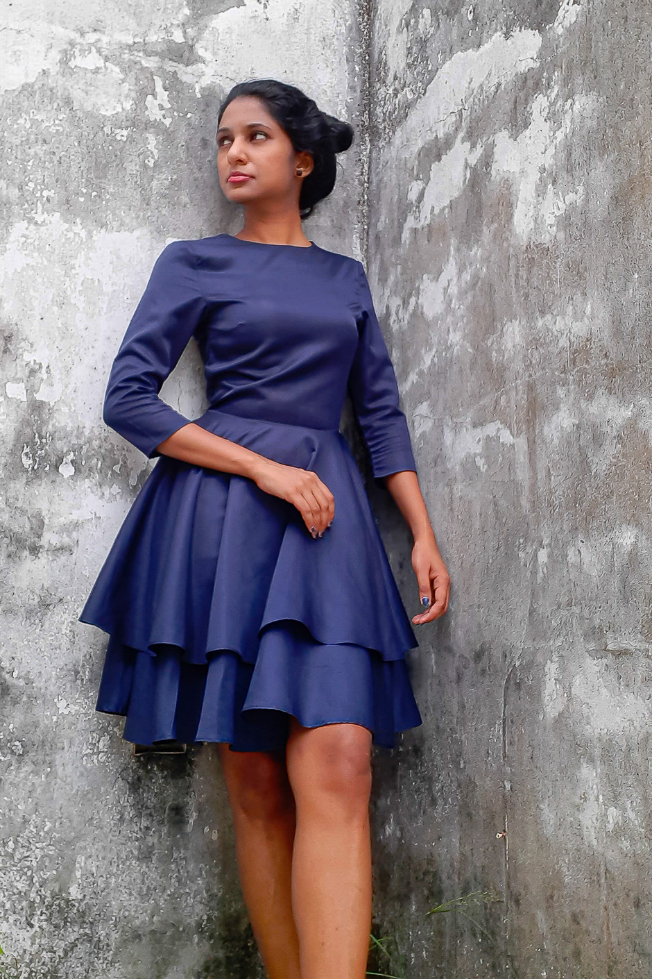 Amara - Layered Hem Dress is made from Navy Blue Polyester and gas long sleeves , flared two layer skirt and fitted waist