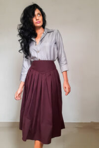 Vera - Pleated Midi Skirt is made from thick Purplish Red Cotton. Skirt is flared and with high-waist 