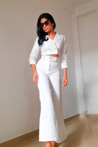 Off White Polyester high waisted wide leg pant and Noori - Cropped Blazer Top is Double Breasted , with 3/4 length sleeves and a crop top